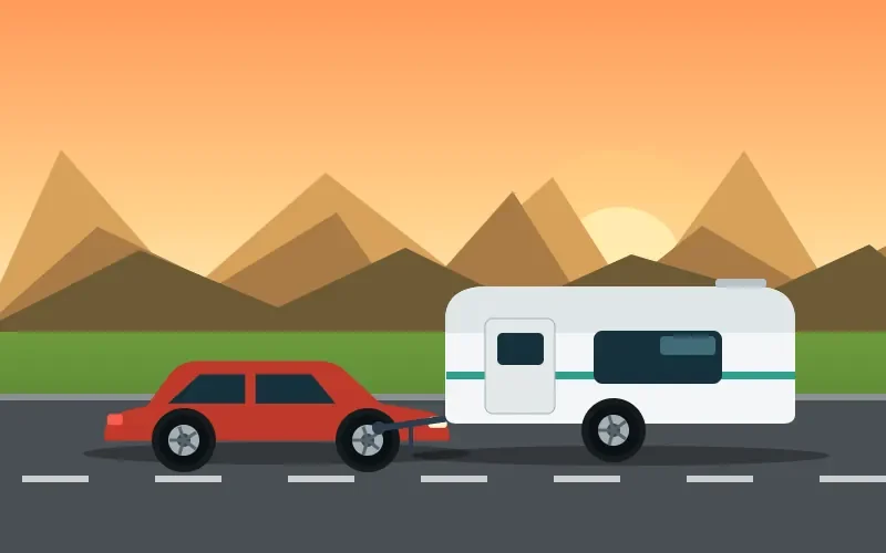A car towing a caravan along a road